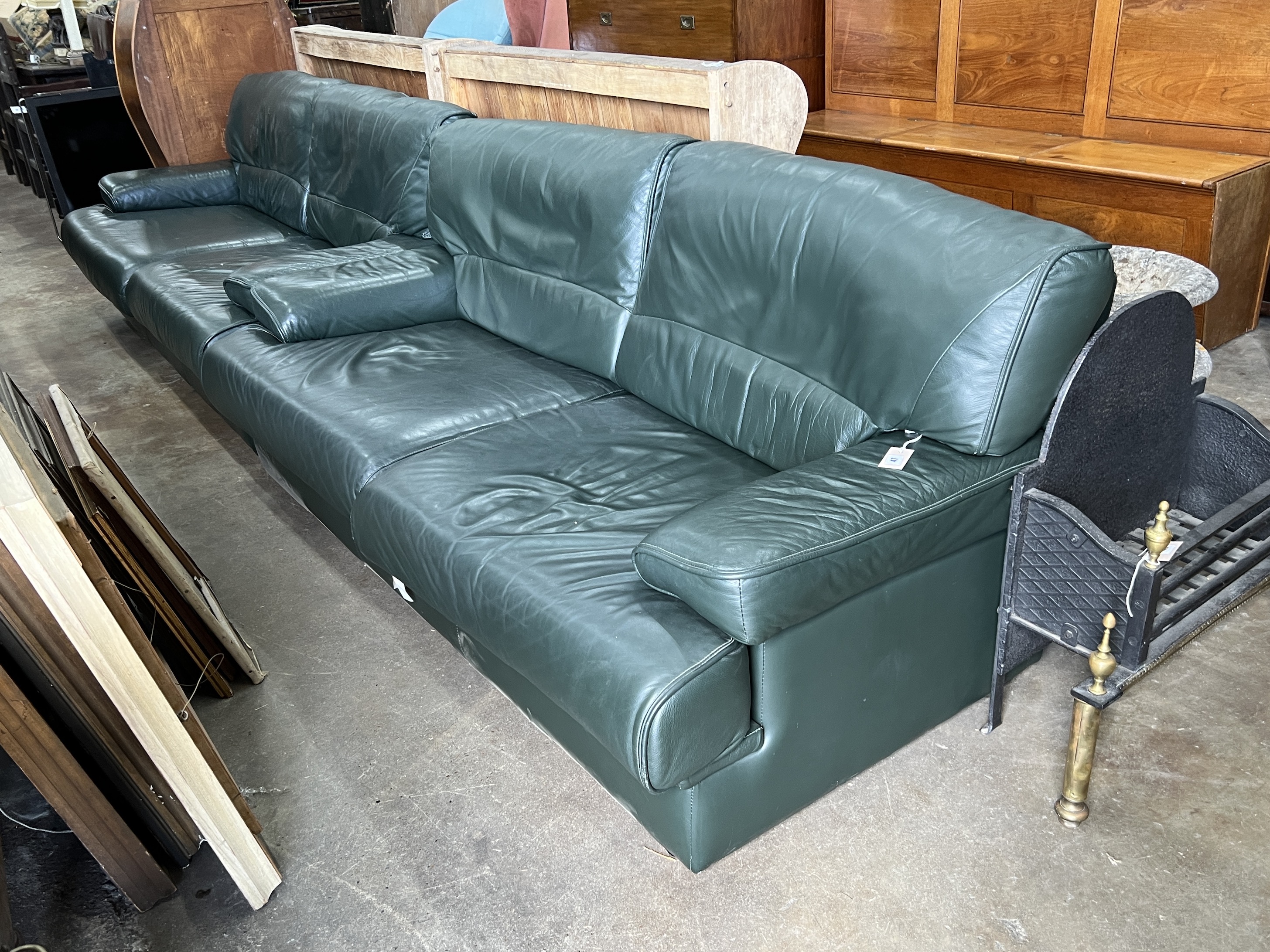 A pair of Army and Navy dark green leather upholstered settees, length 190cm, depth 80cm, height 84cm